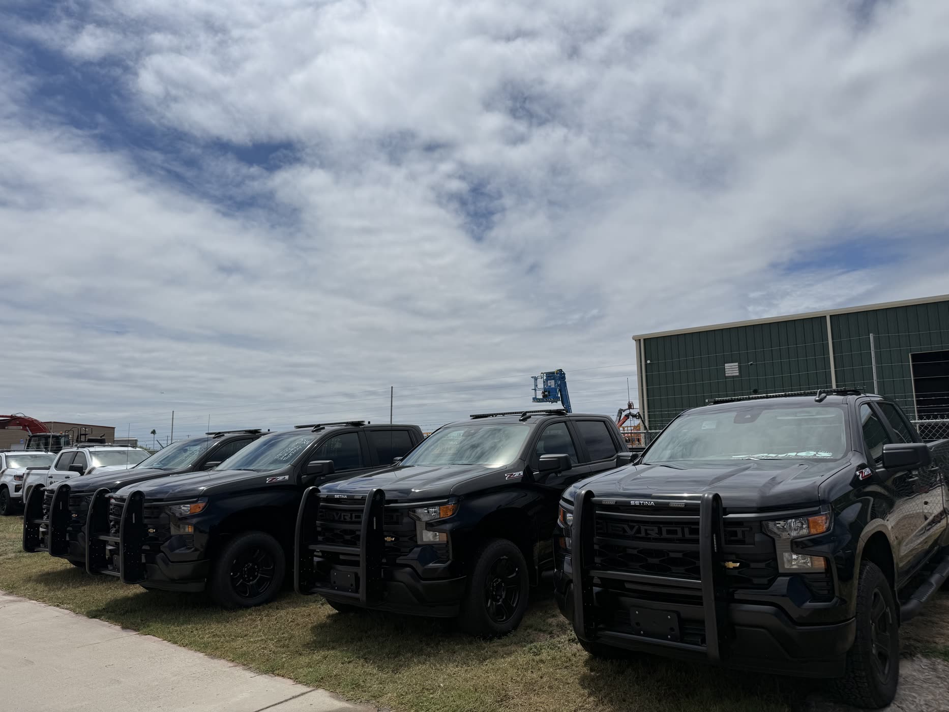 Lineup of prebuilt patrol Silverados on the Sames lot